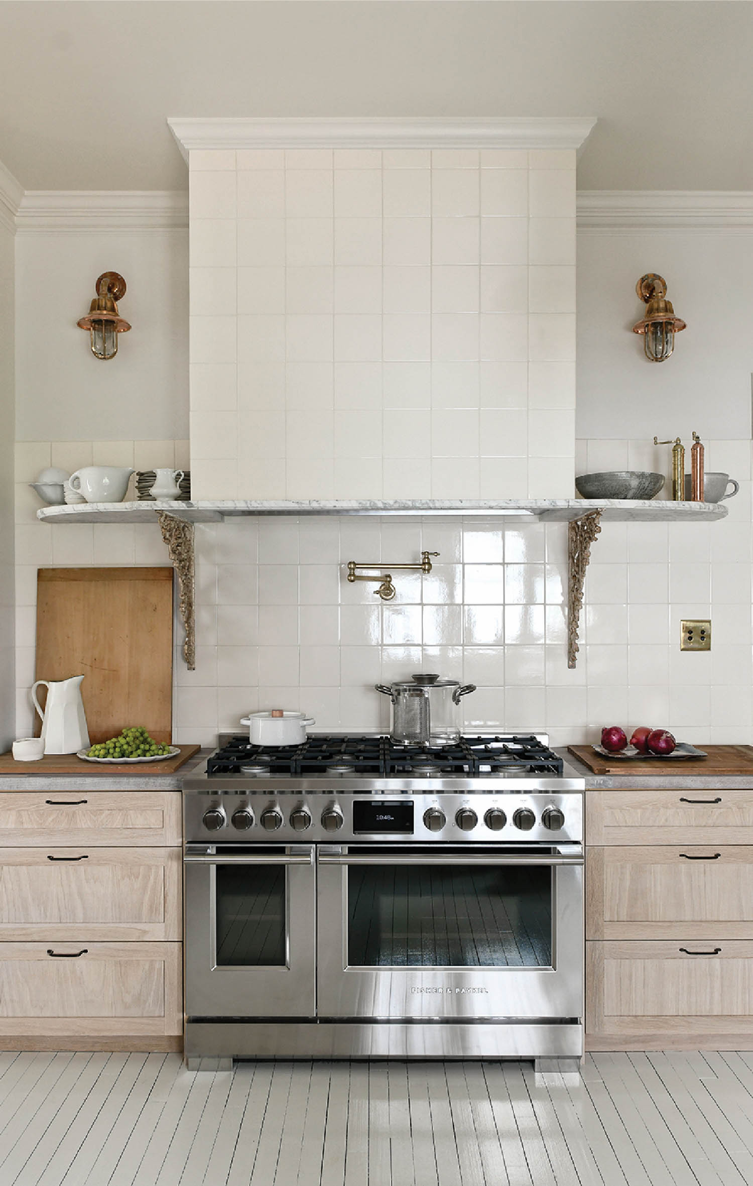 all-white kitchen with stainless steel appliances and wooden cabinets