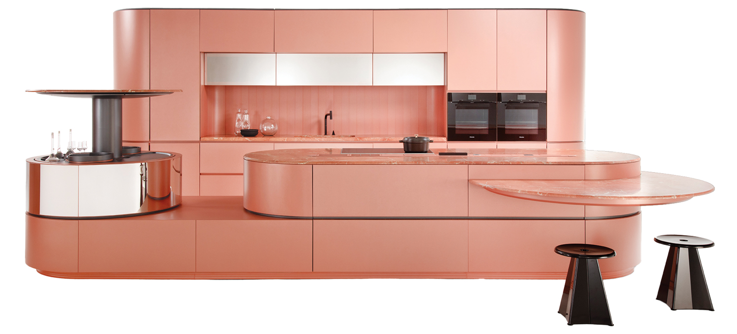 all pink kitchen space with matching hood and island and black stools