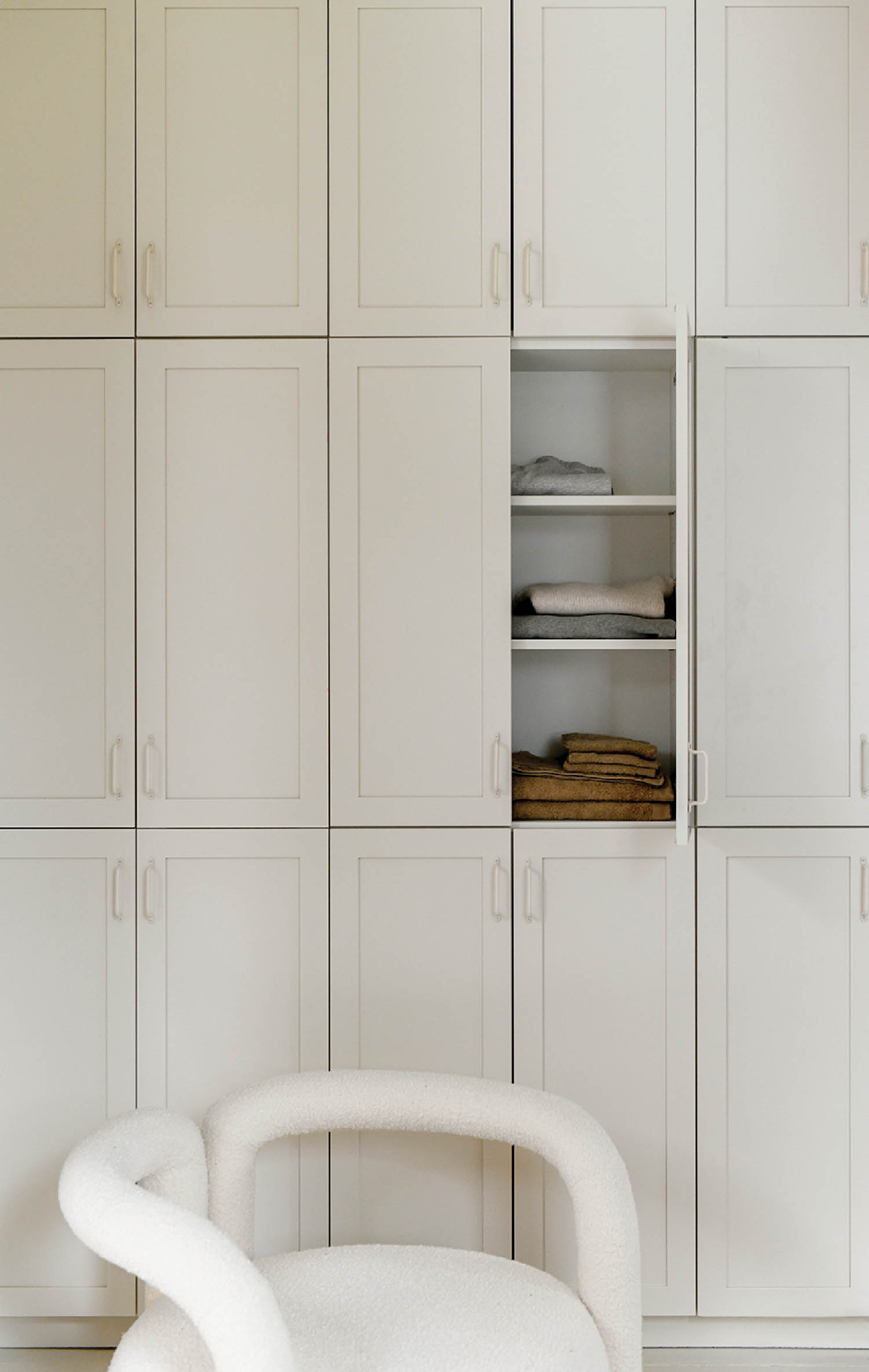 white cabinets and white chair