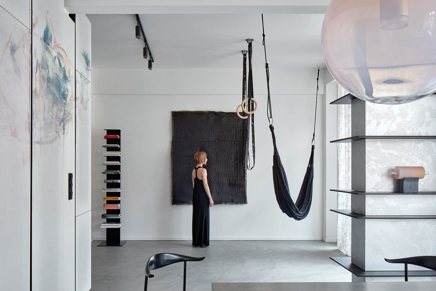 woman staring at hanging black hammock