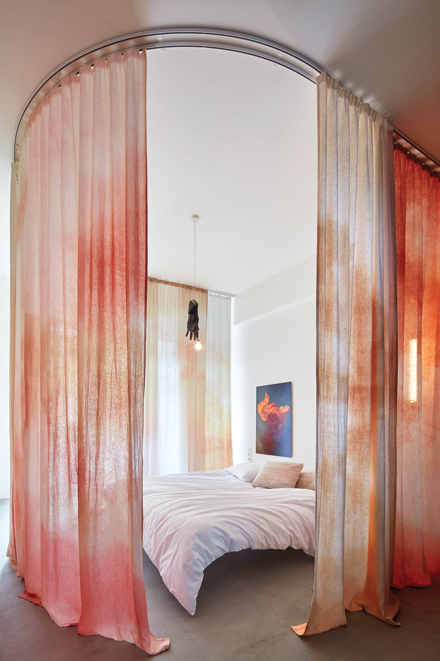 bedroom surrounded by pink drapes