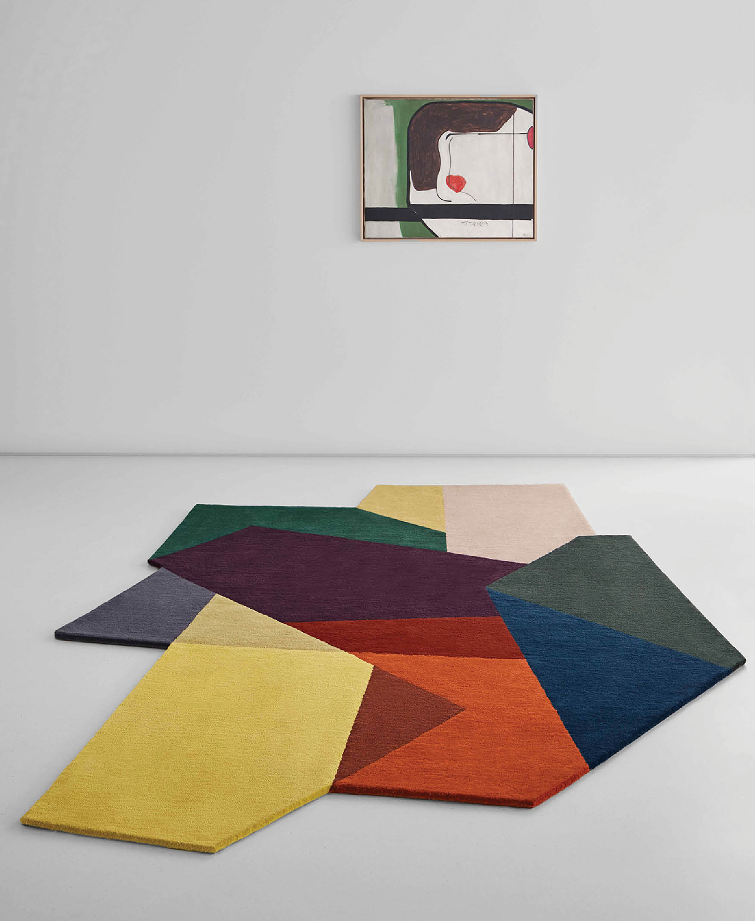 A rug with multiple colors and shapes