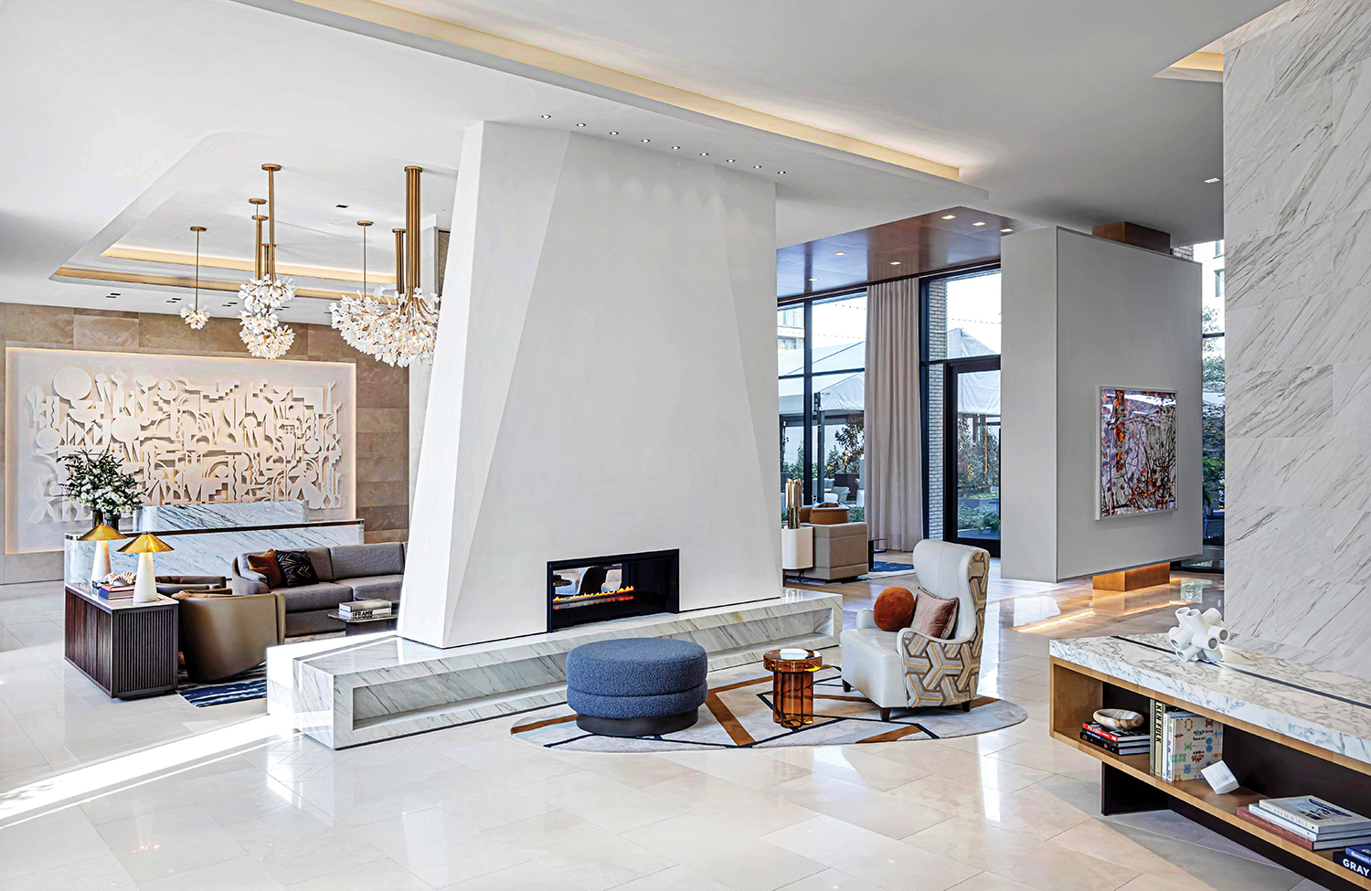 A living room with a large marble fireplace