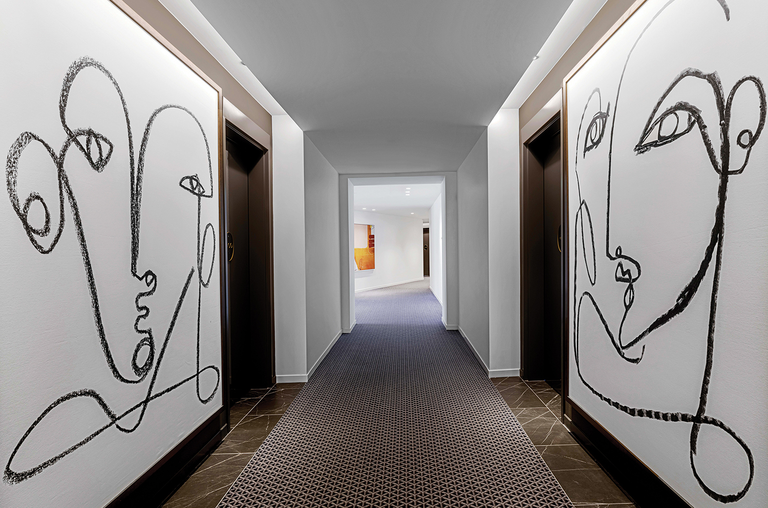 A hallway with a painting on the wall