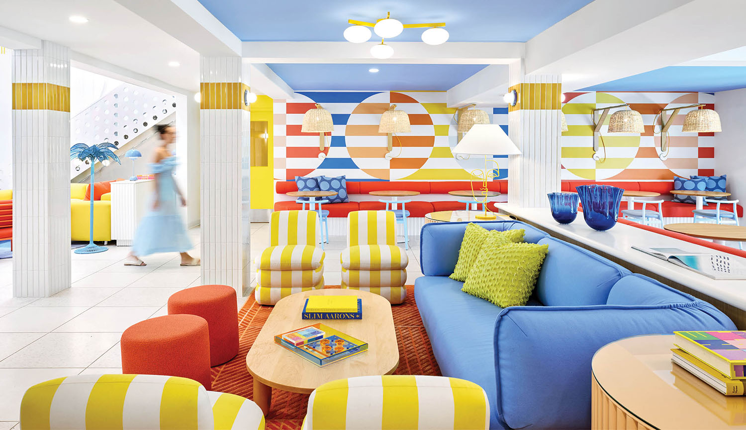 A colorful living room with a blue ceiling