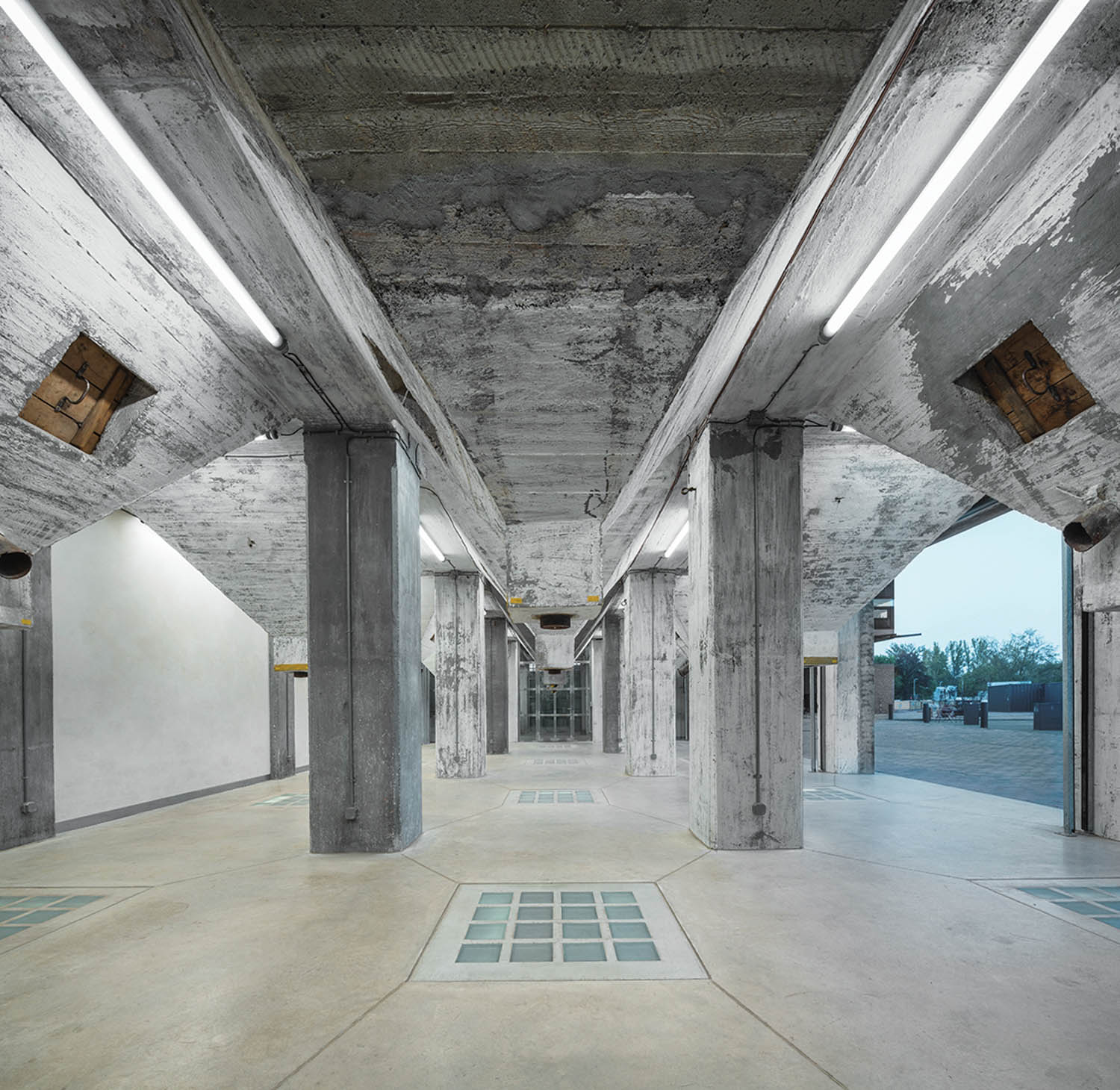 an industrial entry with cement pillars