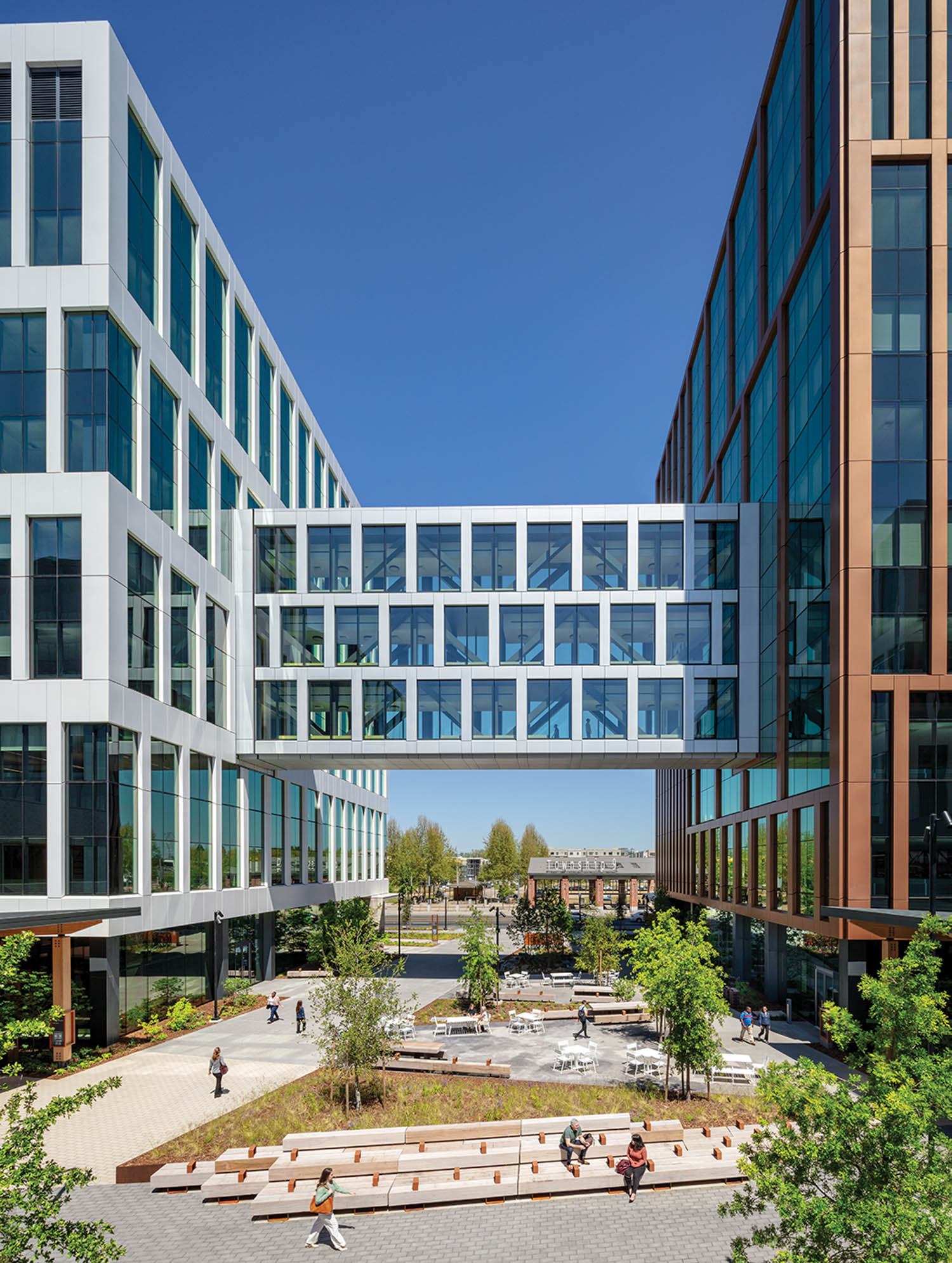 the glass-lined walkway connects two buildings