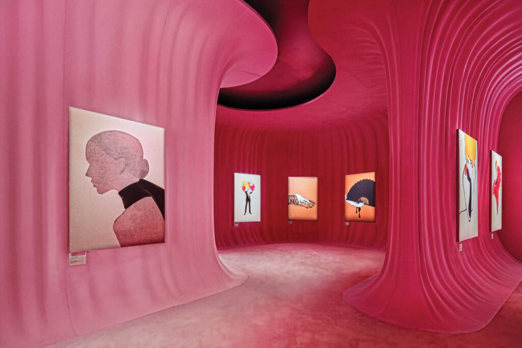 a pink hall with paintings of dior designs