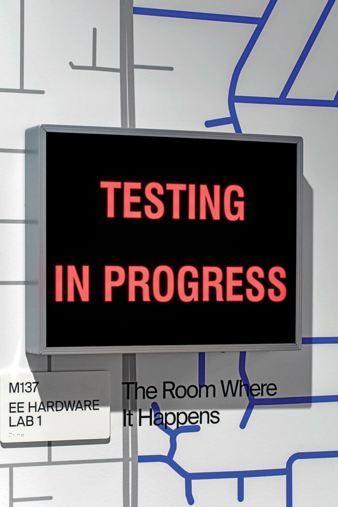 a wall sign that says testing in progress