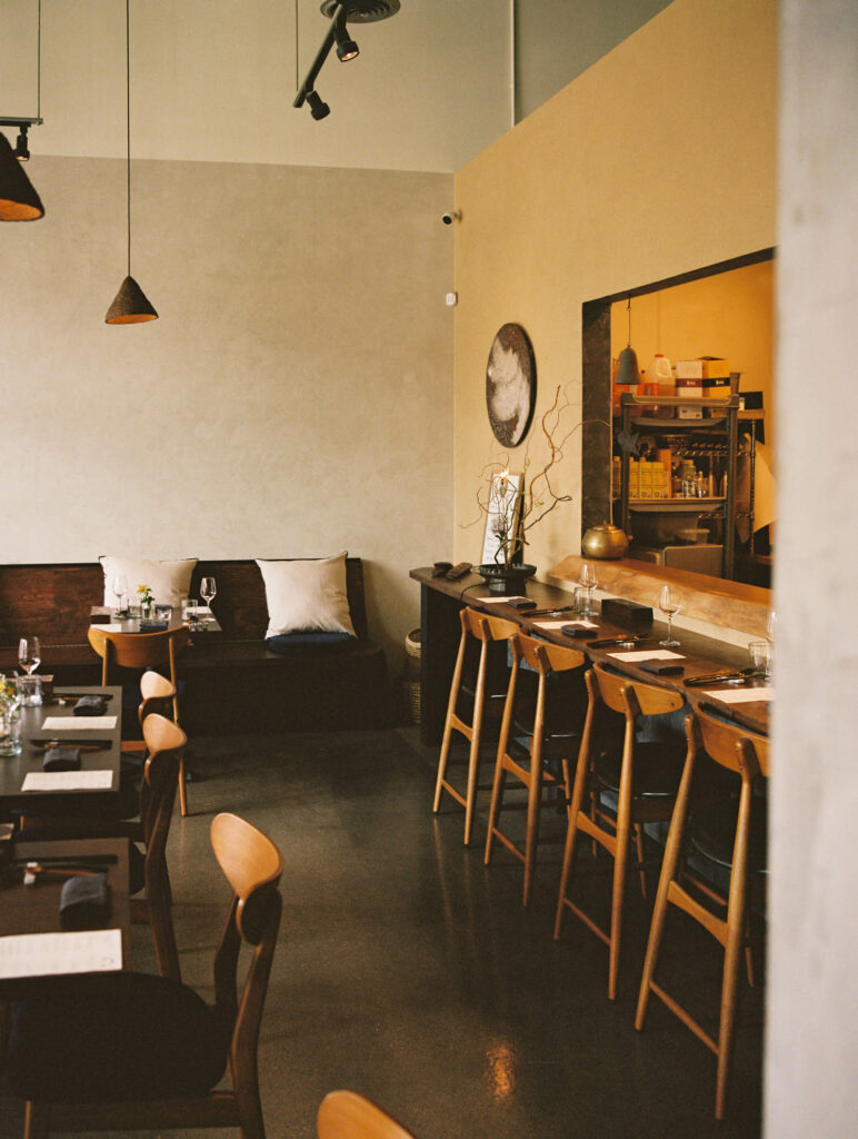 brown barstools in a room with brown bench seating