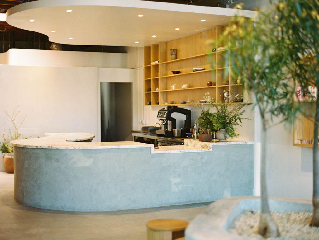 a reception desk made of light blue plaster