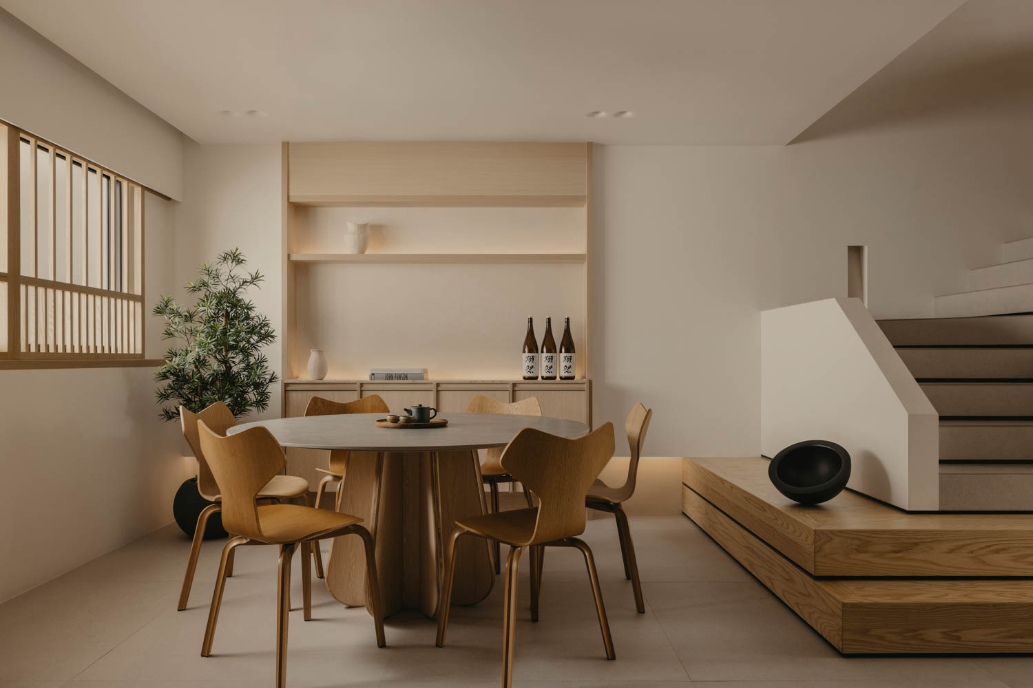 minimalist dining area with wood chairs