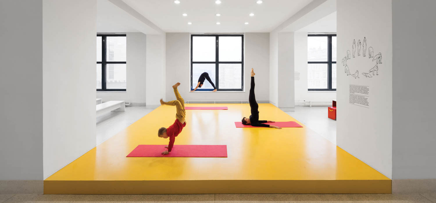 a yoga studio with bright yellow floor