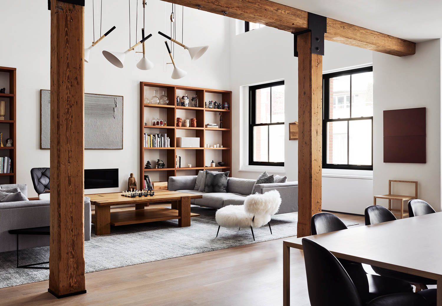 living room with open-air plan, wooden beams and lots of seating