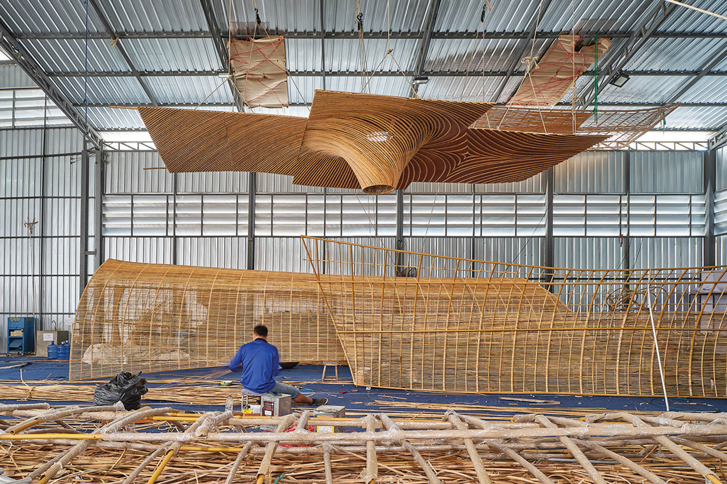 man sitting in front of the pavilion prototype