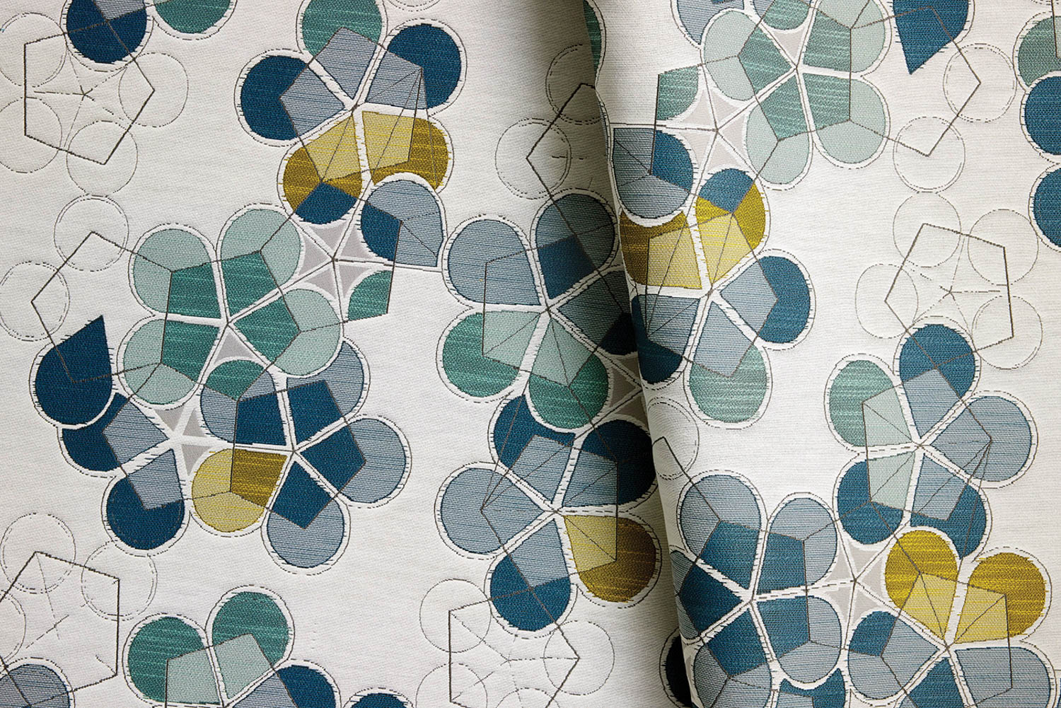 patterns shaped like clovers in blues, greens and yellows