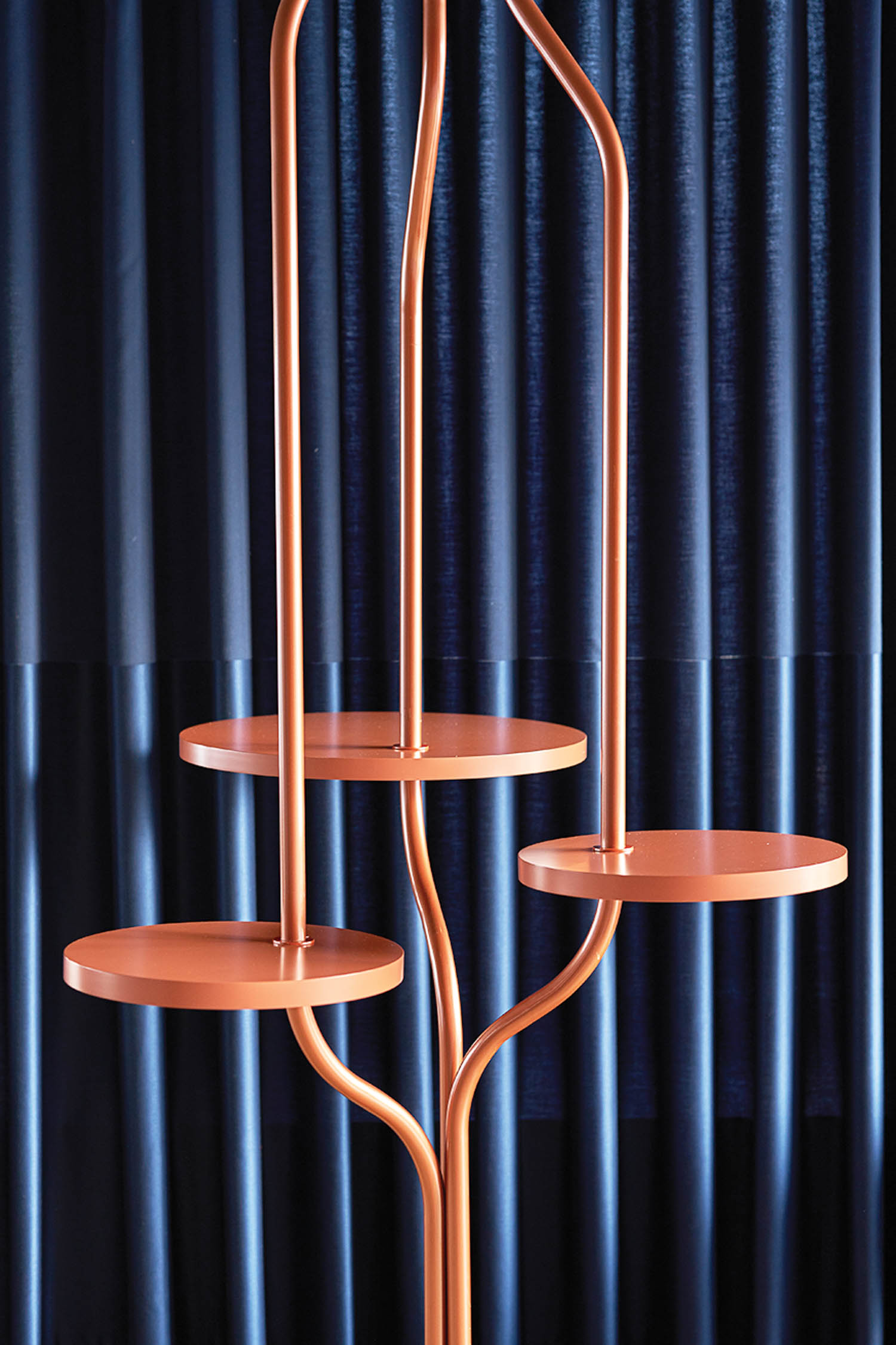 copper sculpture with a blue drape