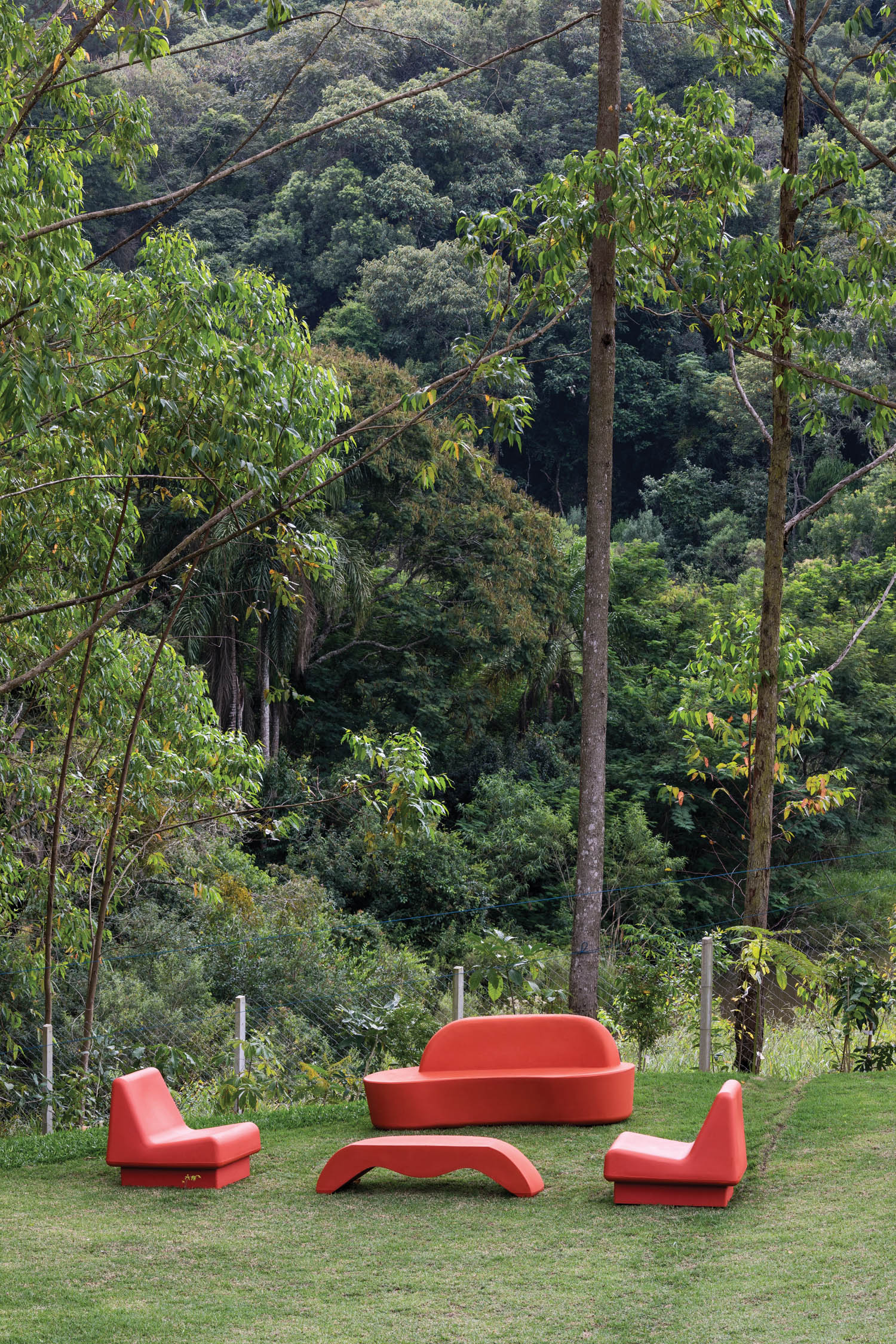 view of the bright red chairs that make up the outdoor patio in the forest