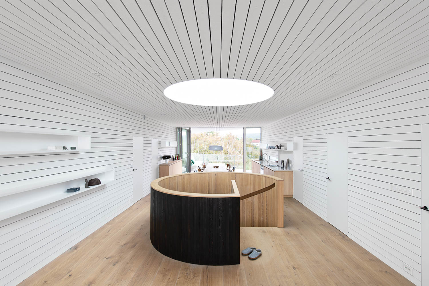 living room with circular table and circular light