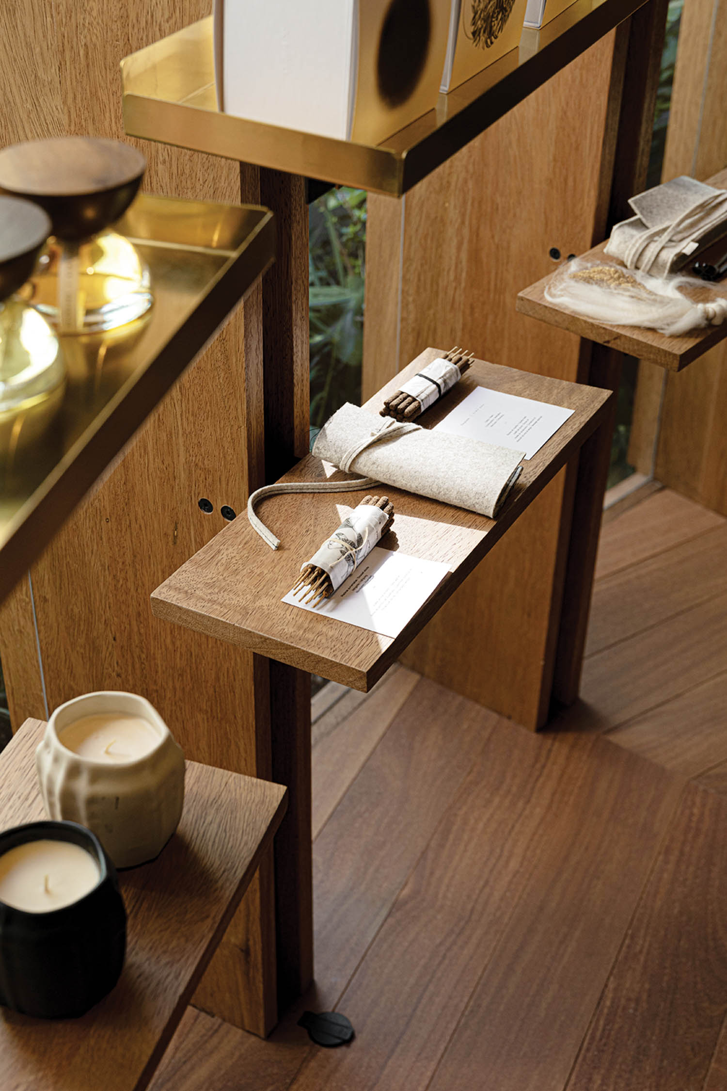 closeup of wooden shelves with cups and other stationery