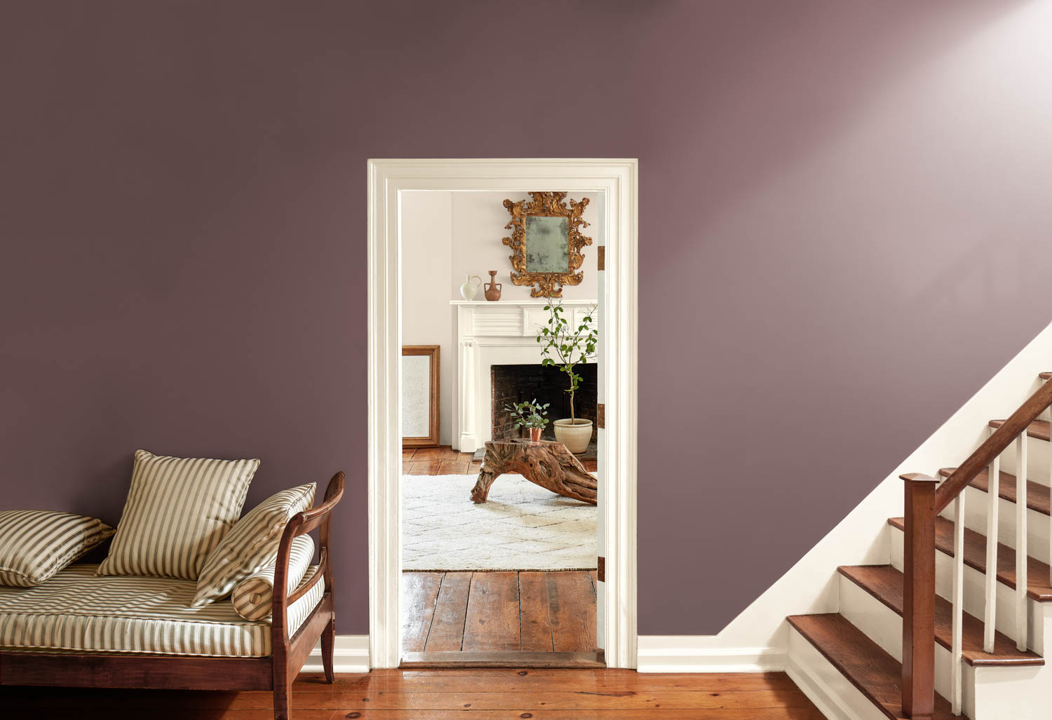 stairway wall has Cinnamon Slate paint with open doorway leading to living room