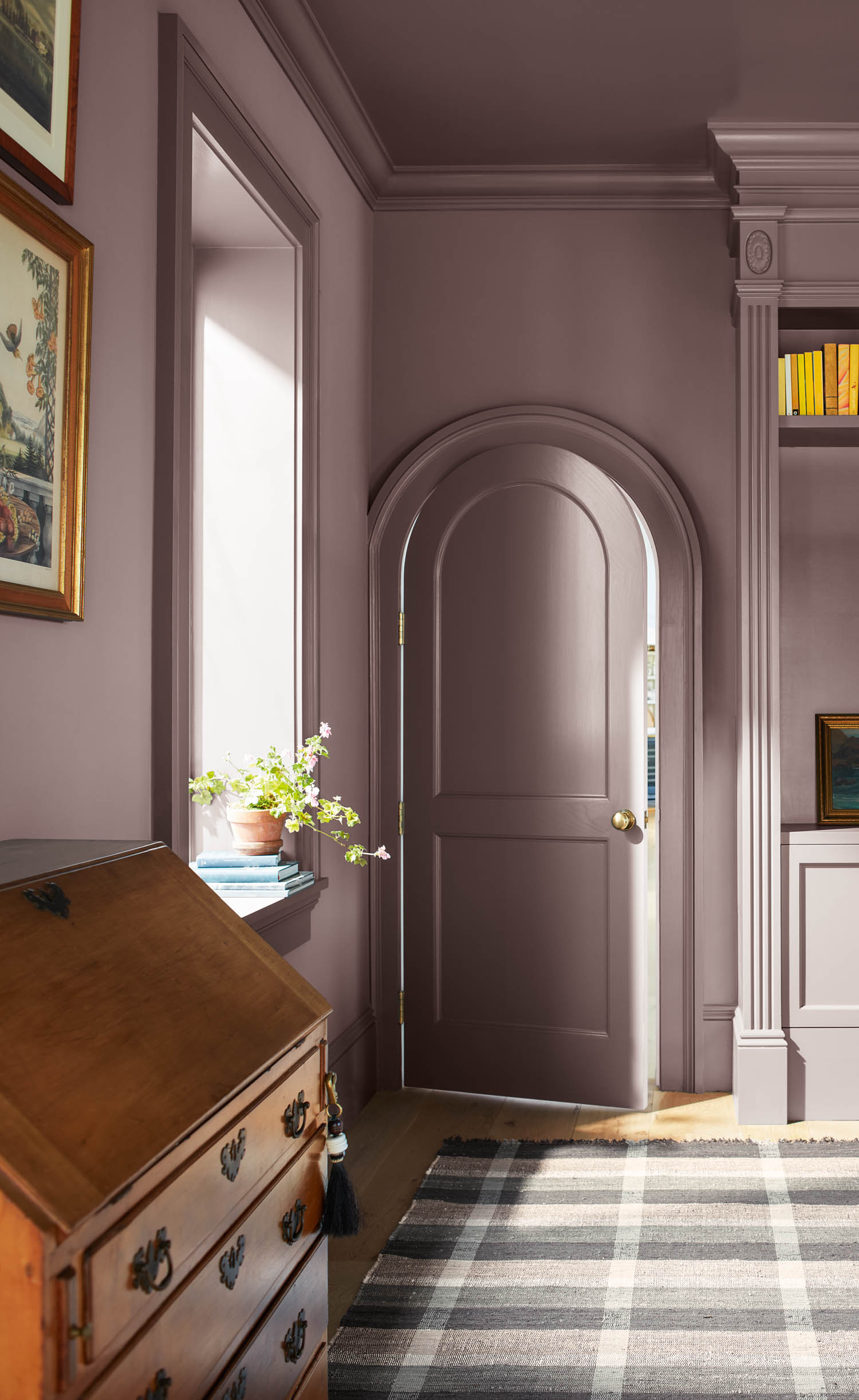 study room with arched Cinnamon slate door and wall, tile floor and desk