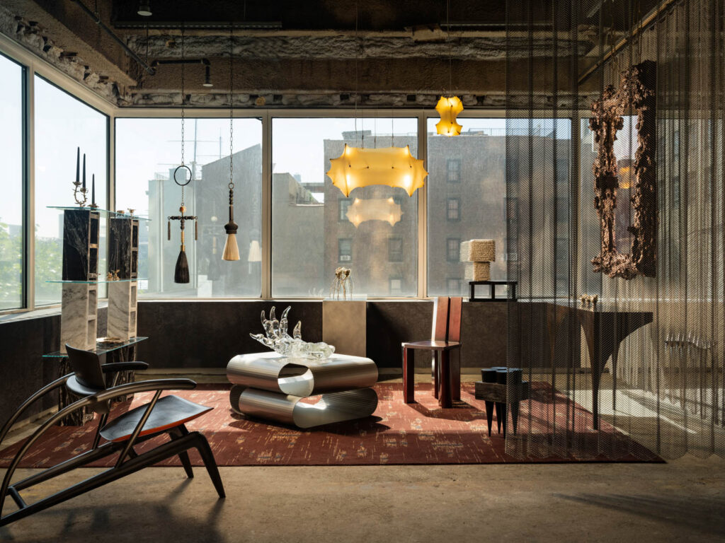 living room area with dark sofa, chandelier and view of the city