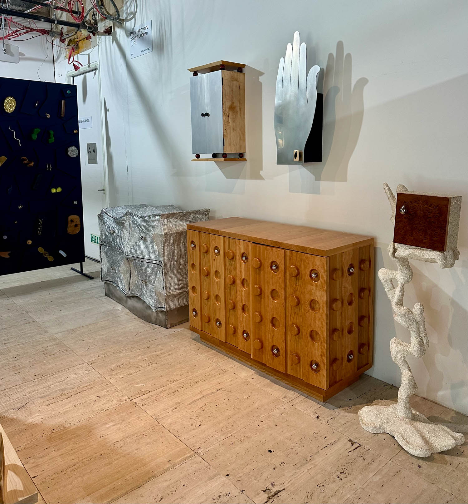 wooden console in room with wooden parquet flooring