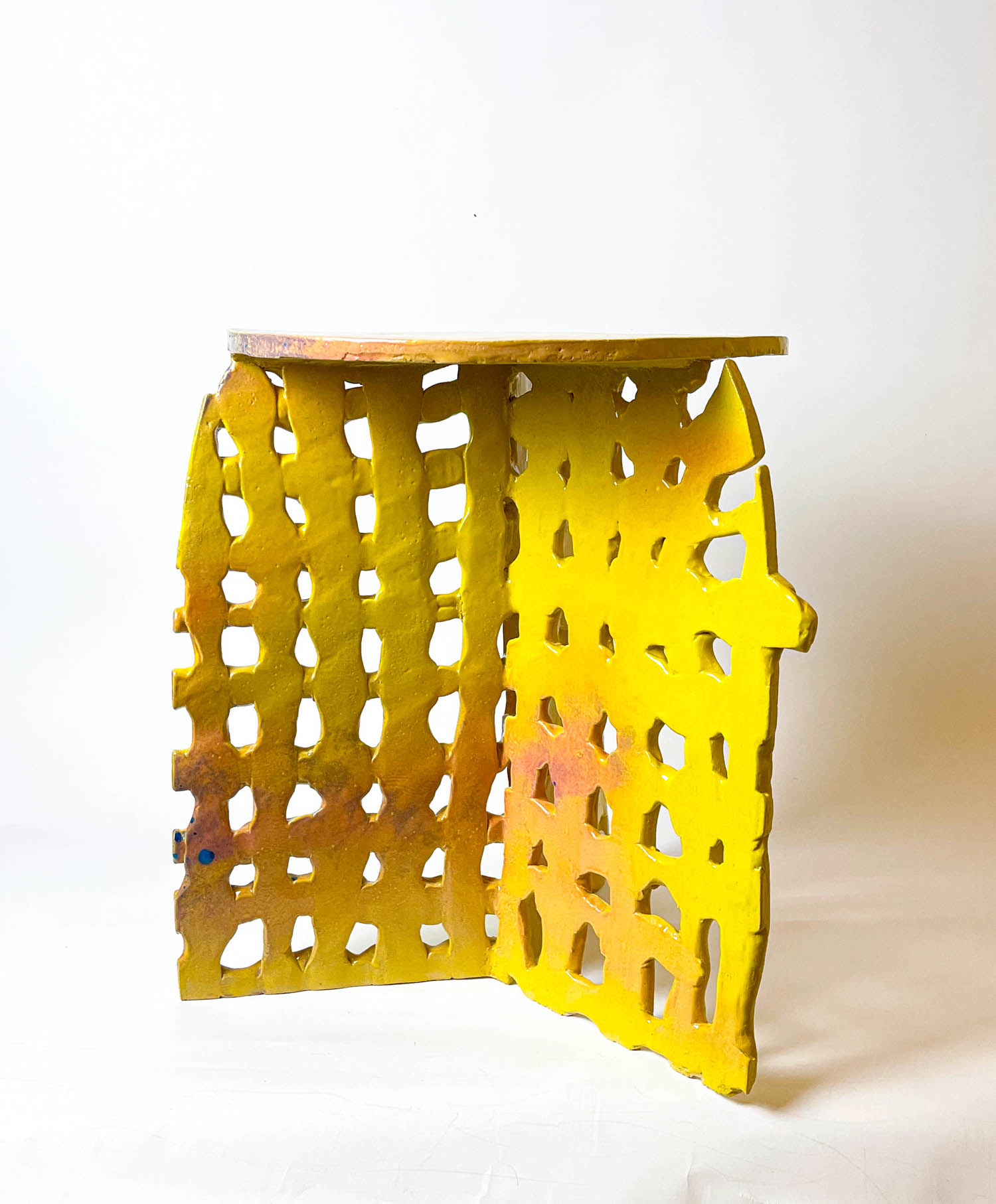 table with a yellow latticed base