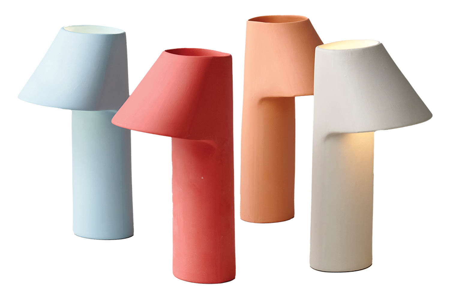 four lamps in pastels that look as if sliced in half