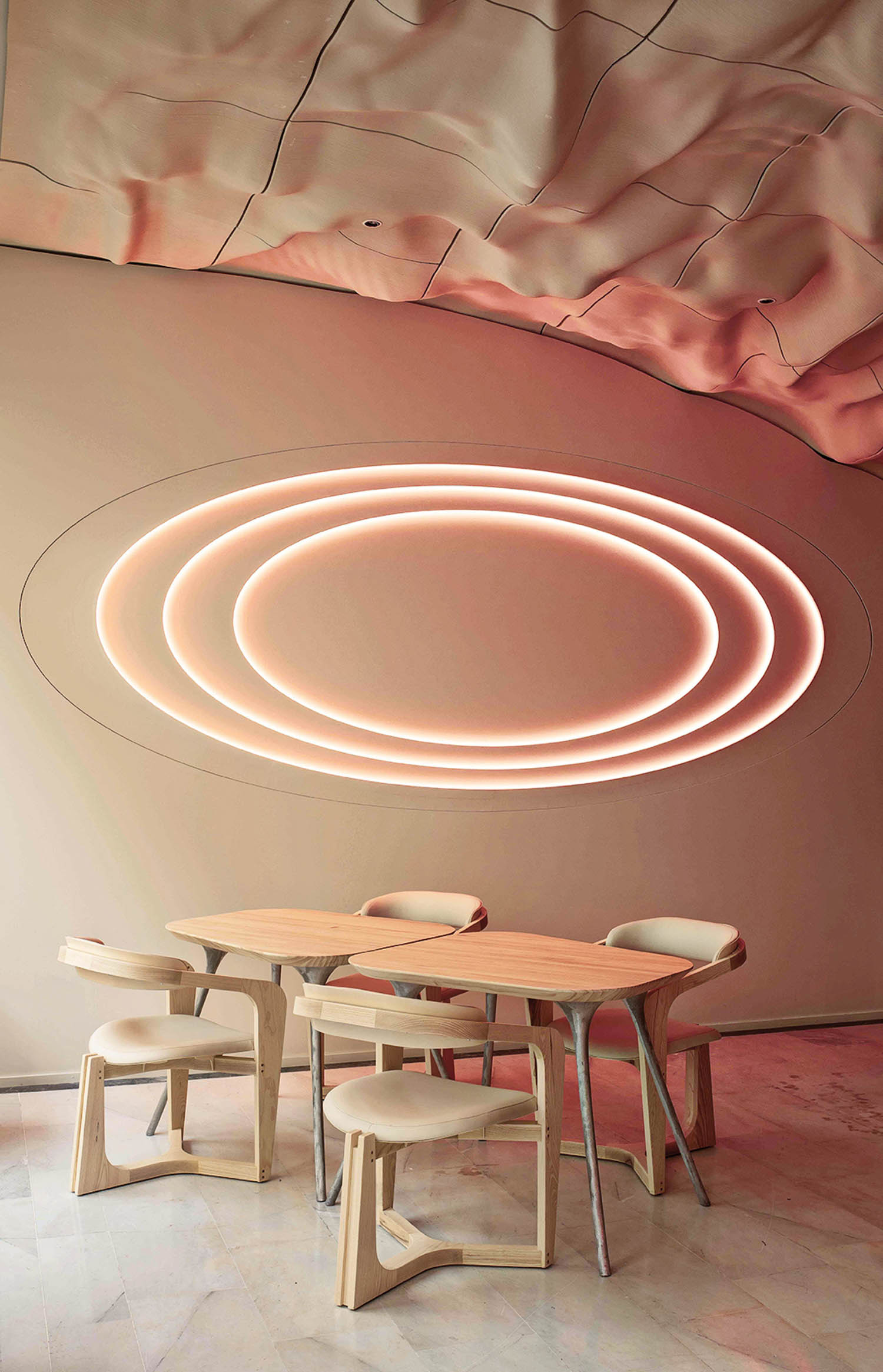 dining area with white chairs and table and red circle lights