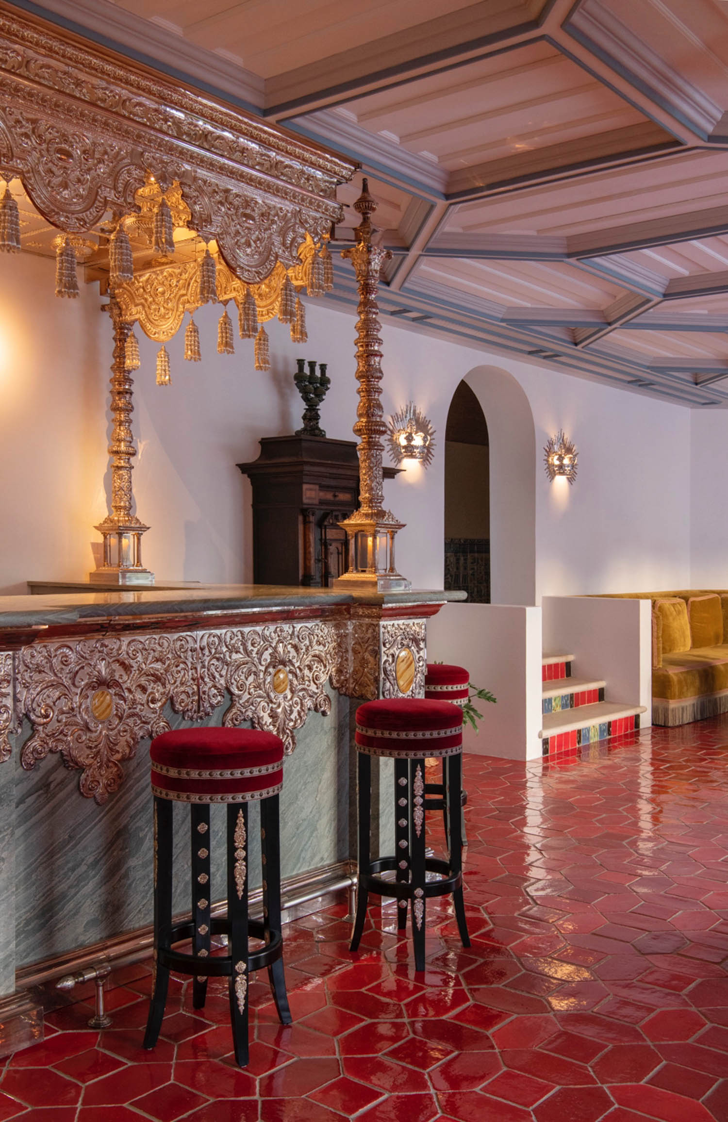 an ornate bar located in the lobby of the Vermelho Melides