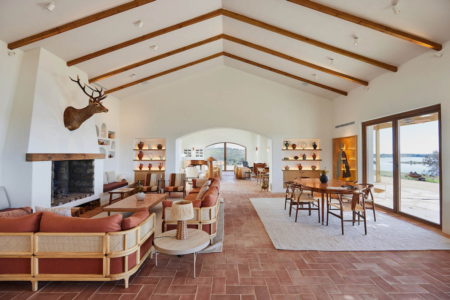 living room with pointed ceiling and lots of seating