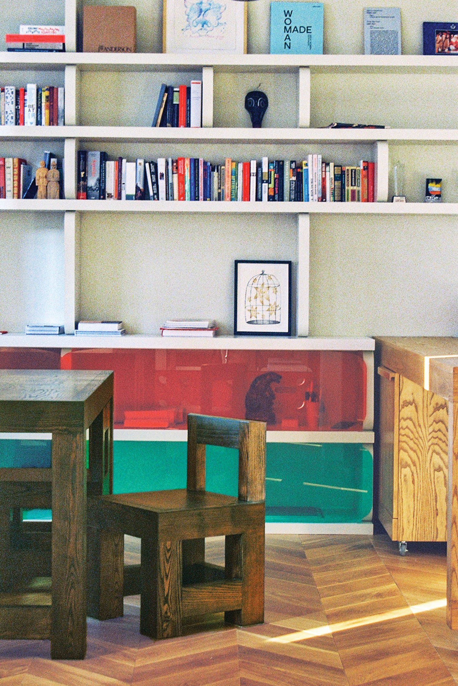 colorful play area with wooden chairs and table