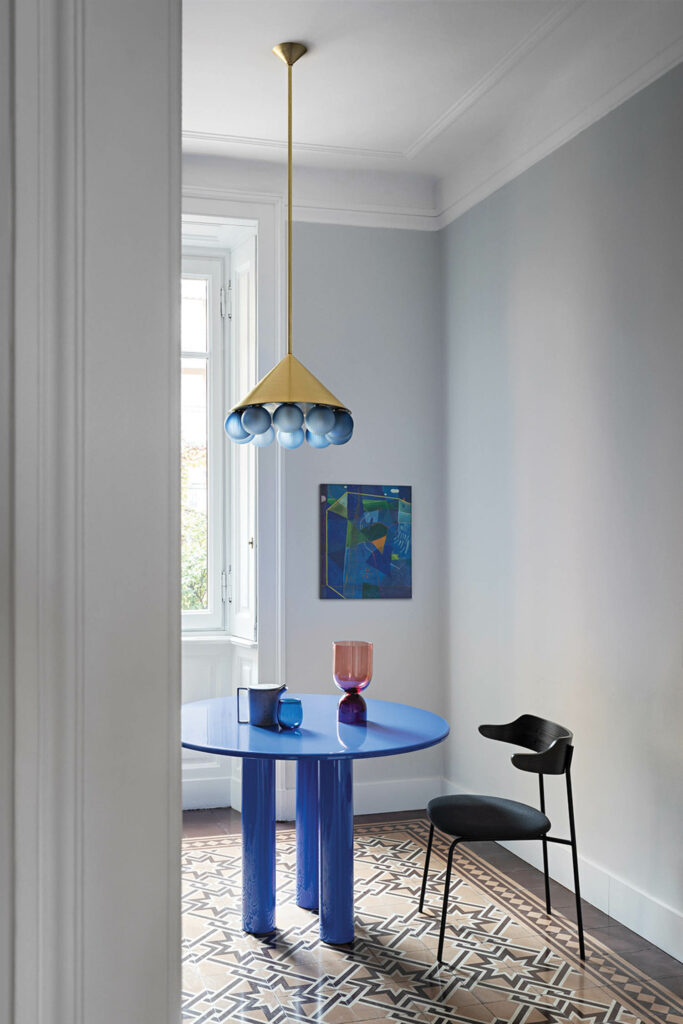 Peak 10 chandelier with brushed-brass finish and textured handblown-glass spheres in Steel Blue by SkLO