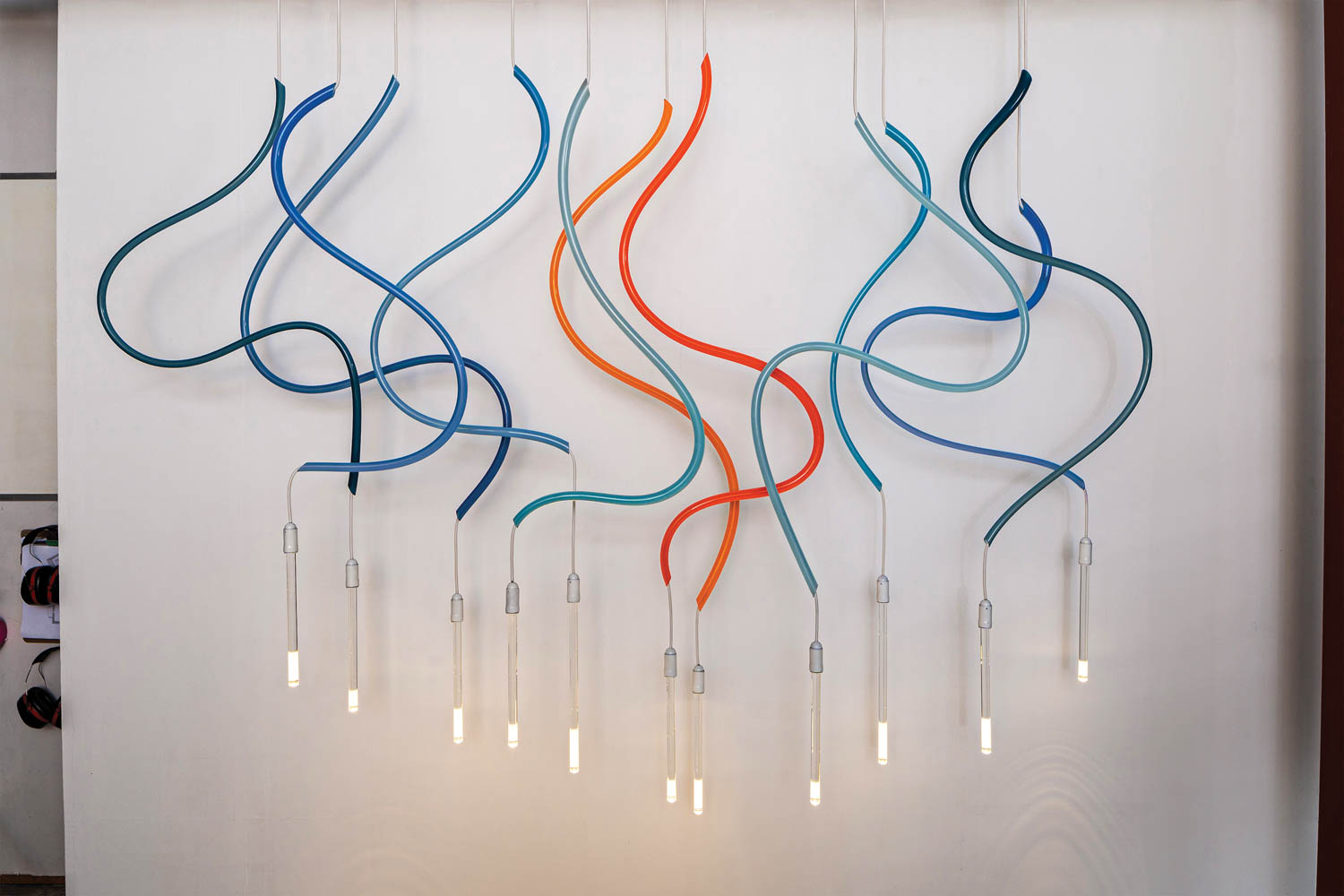 Brad Turner’s Ribbon modular lighting elements in blown glass by The Goodman Studio.