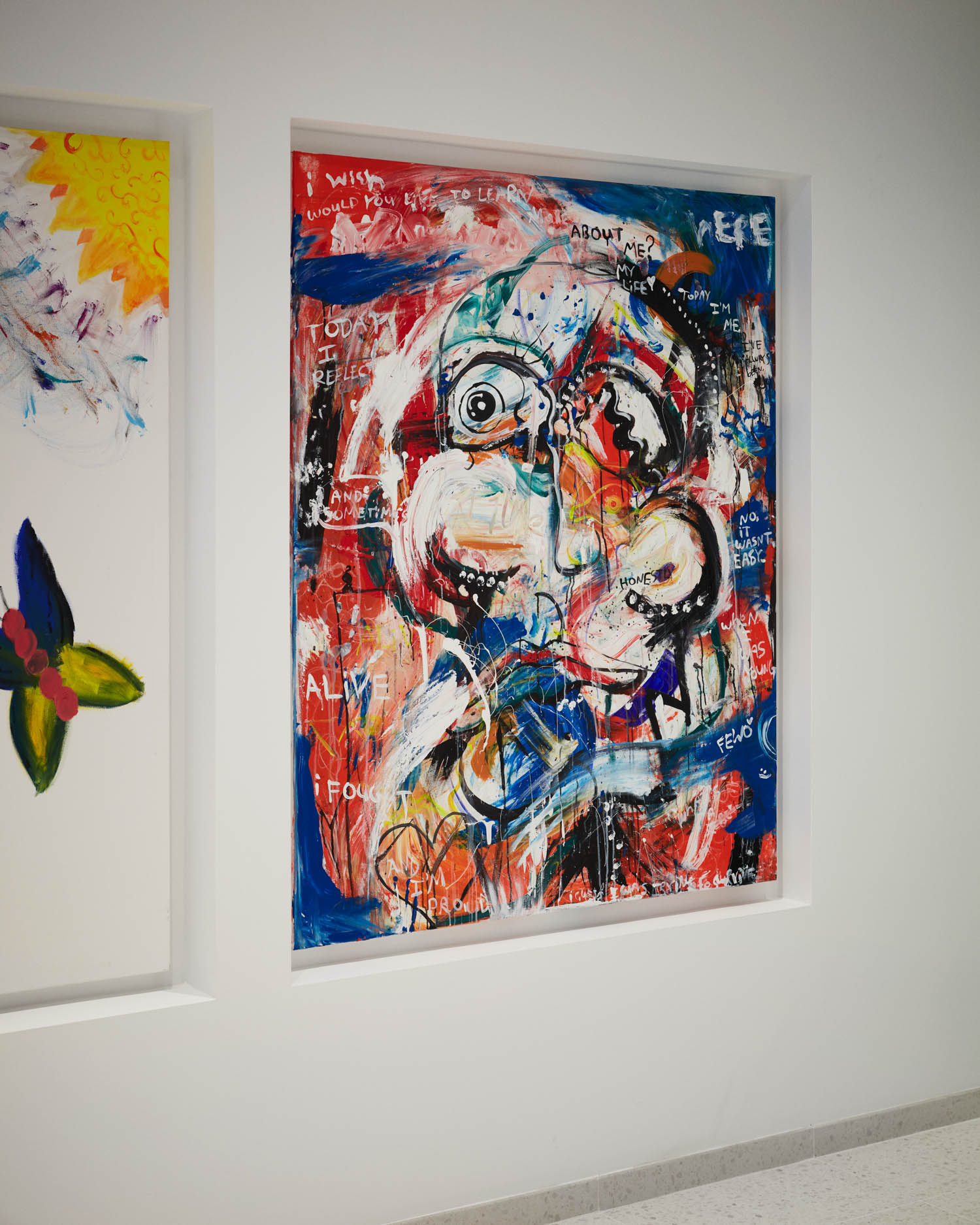 art wall niches with graphic graffiti-like art piece in red and blue